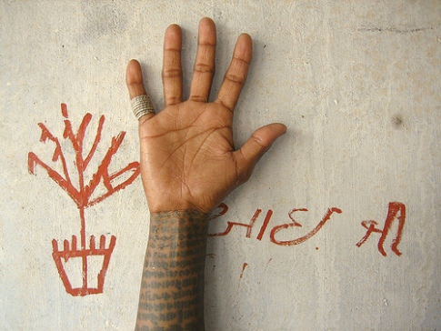 India Tribal Woman's hand shows tatoos